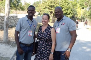 Anny Frederique flanked by librarians Odverne Charles and Besly Belizaire