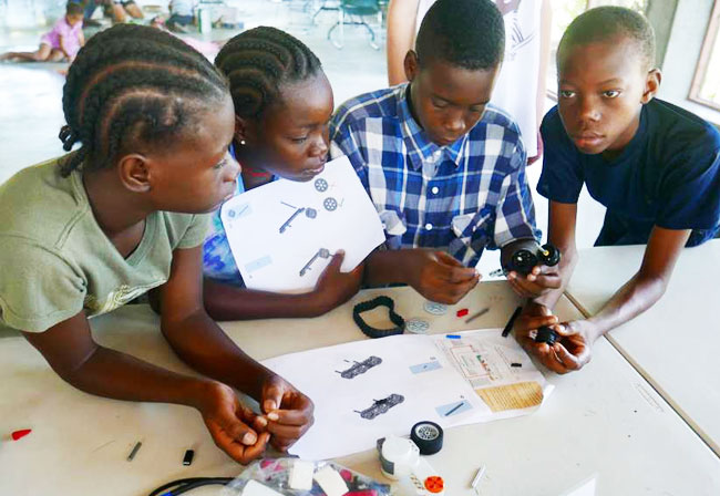4 boys Haiti robotics program