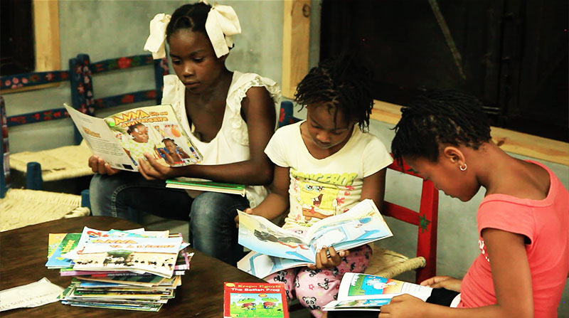 Haitian girls reading in Deschapelles library